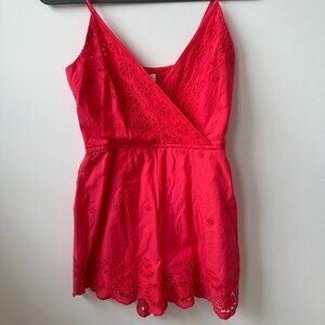 Red romper with floral cutouts